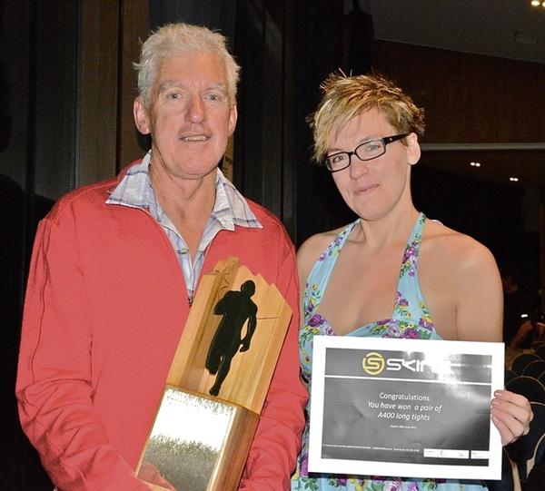 Veteran runner Mark Douglas with his Perserverance Trophy and daughter Fleur Douglas. 